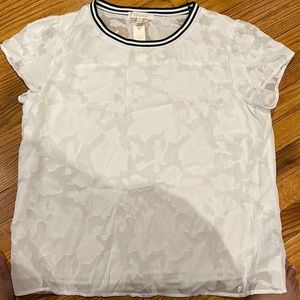 White with appliqués. Size XL